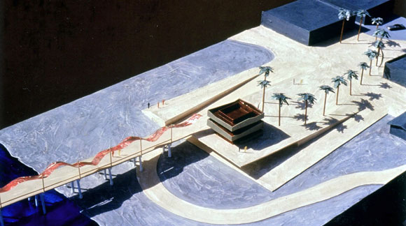 Public plaza sloping down to the beach and up to the horizon, with renovated lifeguard tower, palm trees in an elliptical arc, bike path, and ribbon-like metal canopy